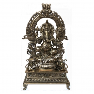 Lord Ganesha Sitting on a decorative throne hand carved brass statue